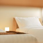 Twin beds with neutral palette, JOSIRE Residence