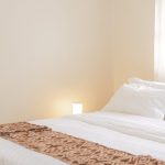 Queen bed with crisp white linens, JOSIRE Residence