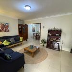 Bright common lounge with seating and reading nook, JOSIRE Residence
