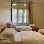 Twin room with two single beds and sheer curtains, JOSIRE Residence